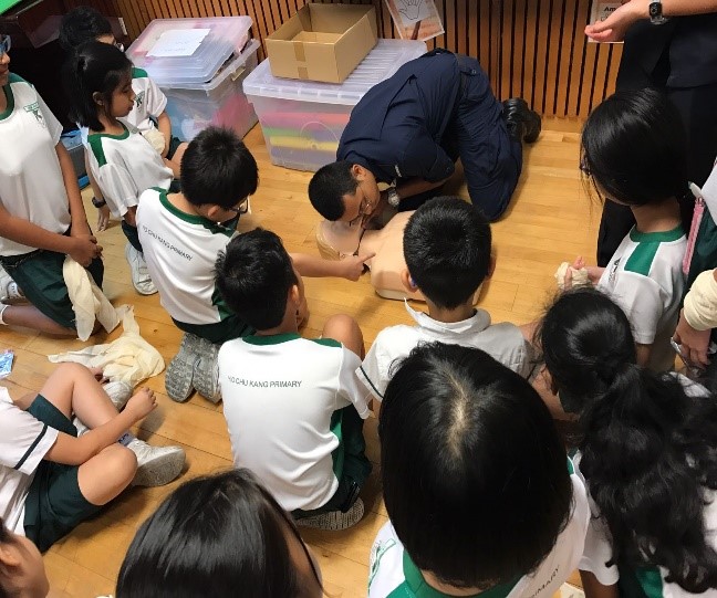 SCDF officer showed pupils the correct way of doing the CPR.