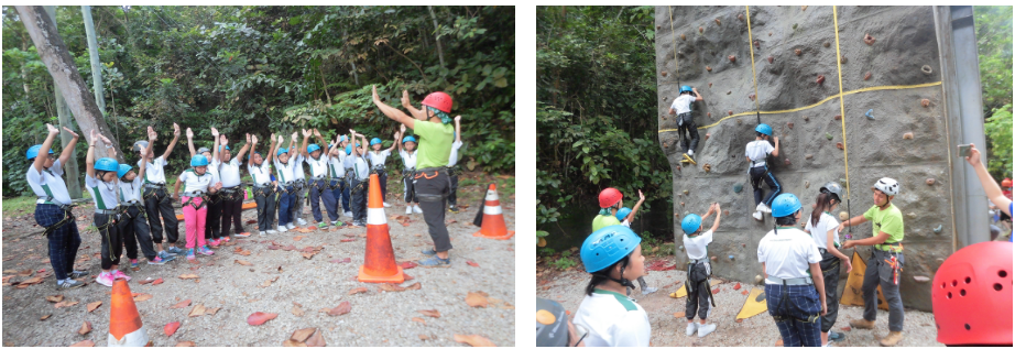 Pupils demonstrating how they are going to support their group mates when they descend from the rock wall. Physical challenges through conquering rock wall develop confidence level among pupils.