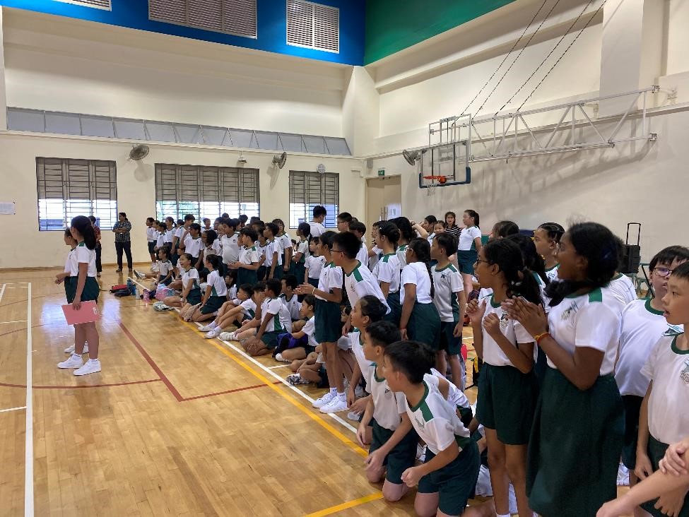 Rooting and cheering on their classmates to play their best.